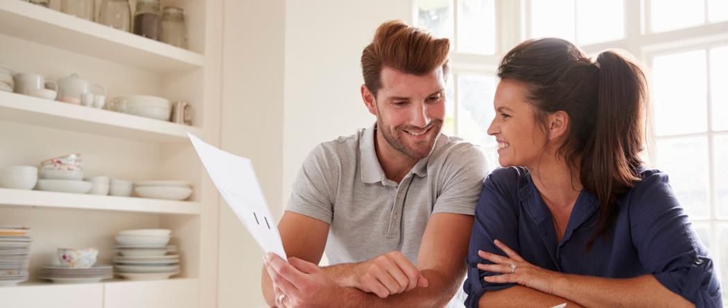 couple looking at a piece of paper